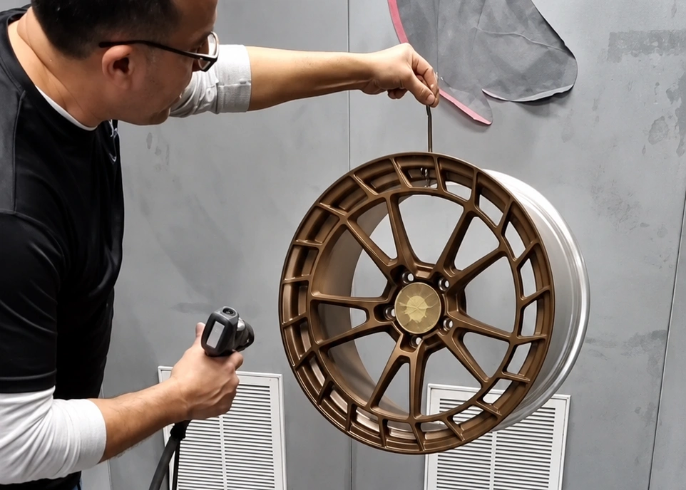 A wheel being coated in the Raven workshop