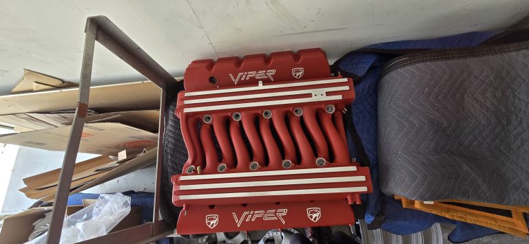Engine covers hanging on a workshop rack