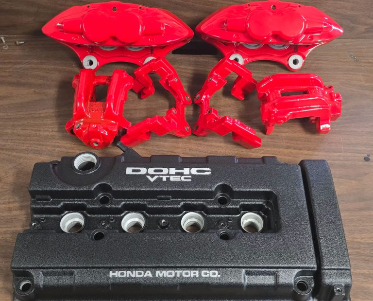 Brake components and an engine cover arranged on a table