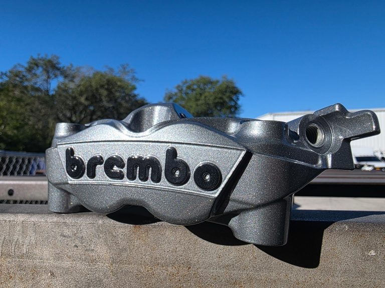 Close view of a brake caliper outdoors