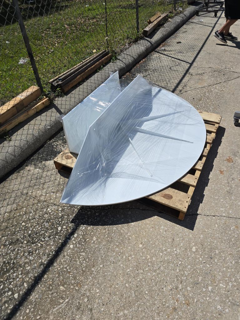 Round fabricated panel resting on a pallet