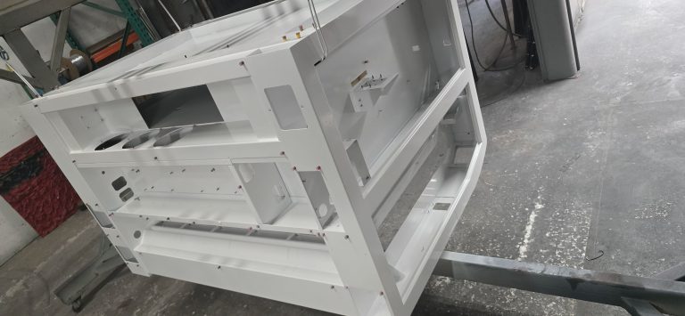Box-shaped fabricated frame suspended in the workshop