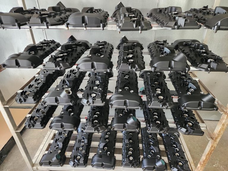 Rows of matching components arranged on workshop tables