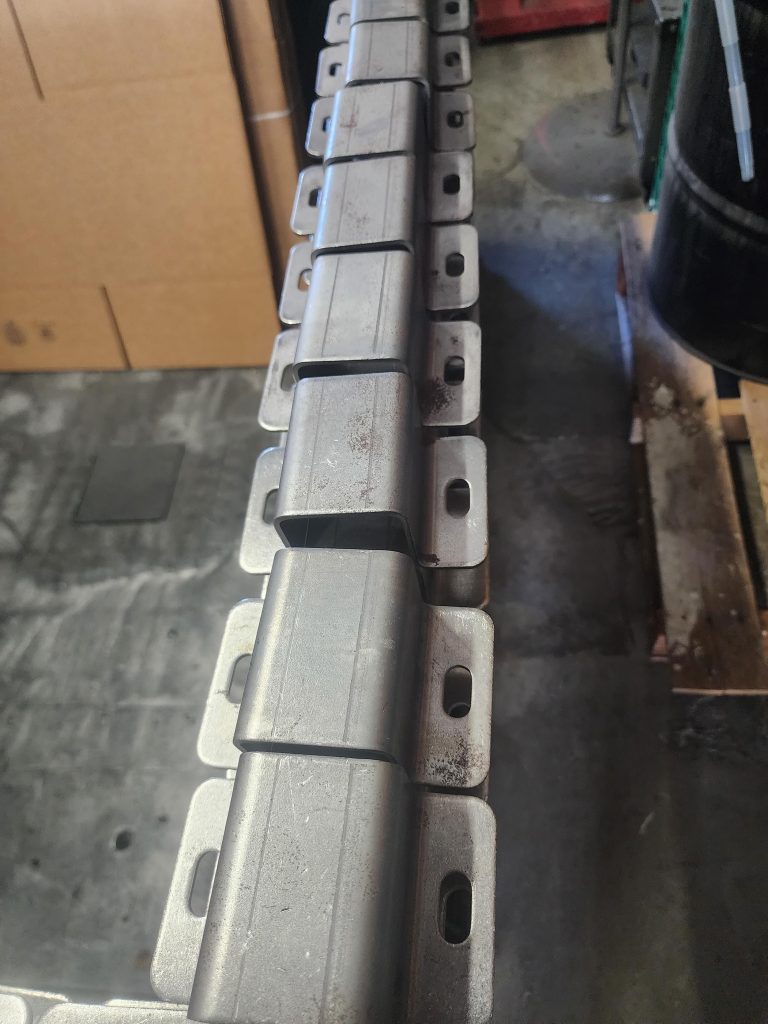 Row of small rectangular pieces on a workshop support