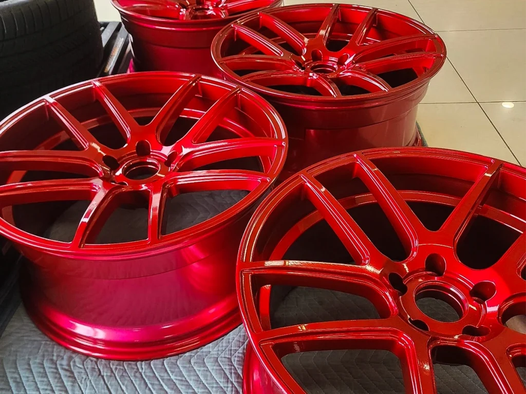 Glossy red coated wheels in the shop