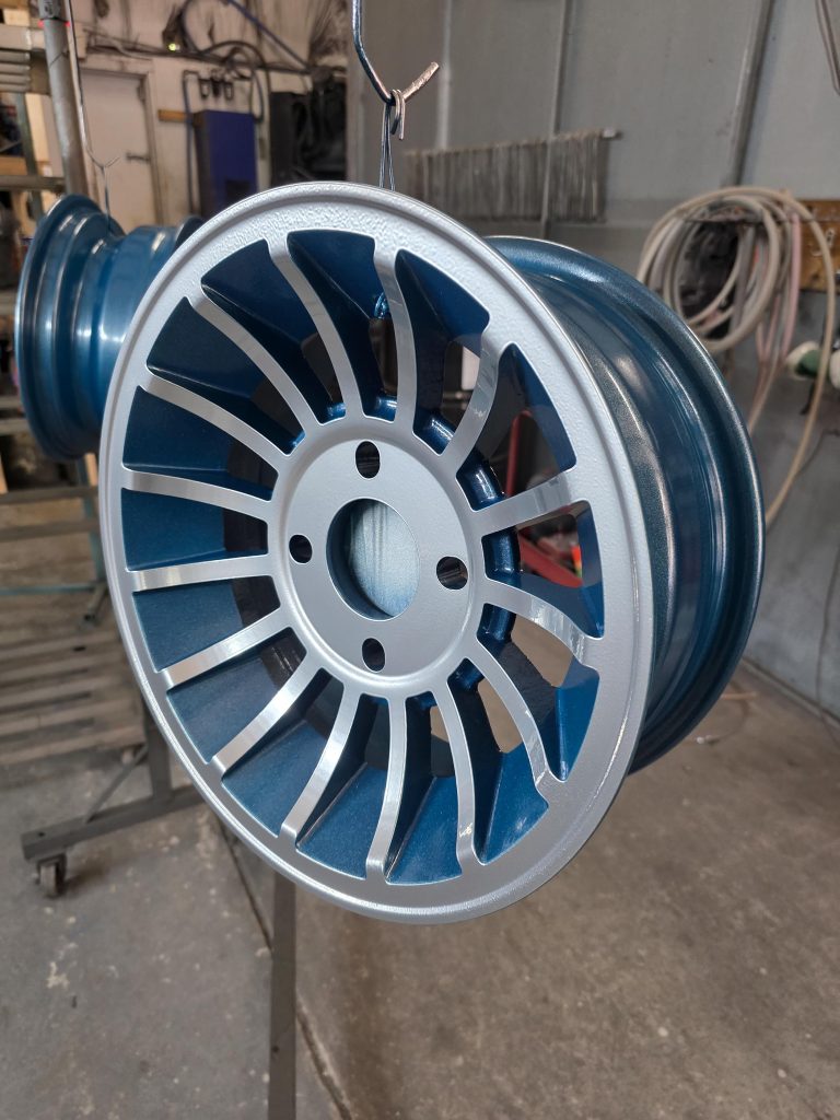 Wheel with narrow spokes suspended in the workshop