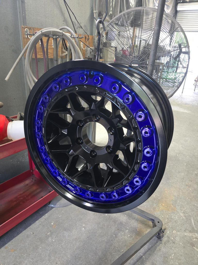 Wheel with a contrasting outer ring hanging in the shop